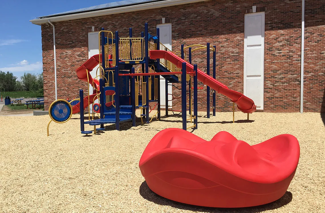 Small school playground equipment at Lotus School